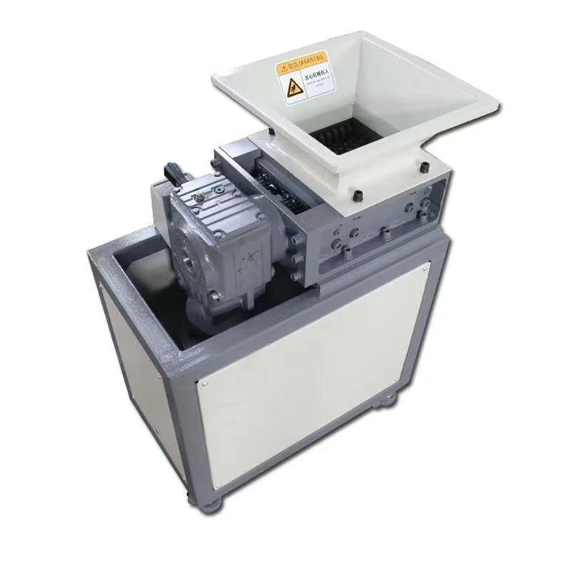 Compact shredder with a square feed hopper and enclosed lower cabinet.