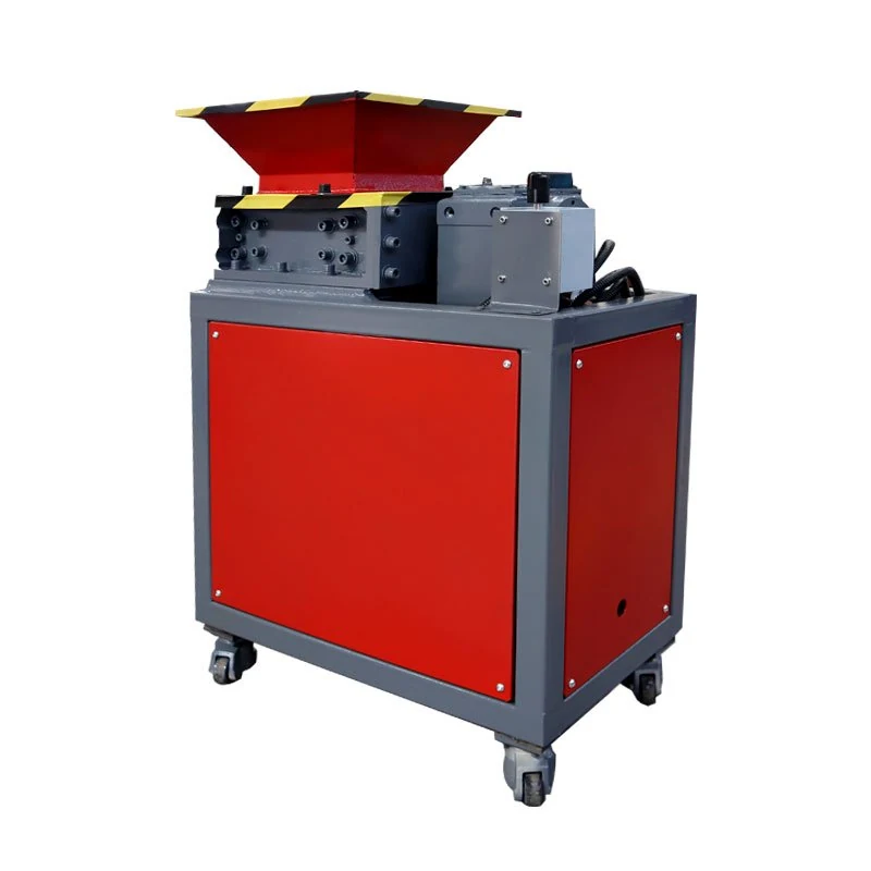 Compact plastic shredder with a red feed hopper and wheeled cabinet.