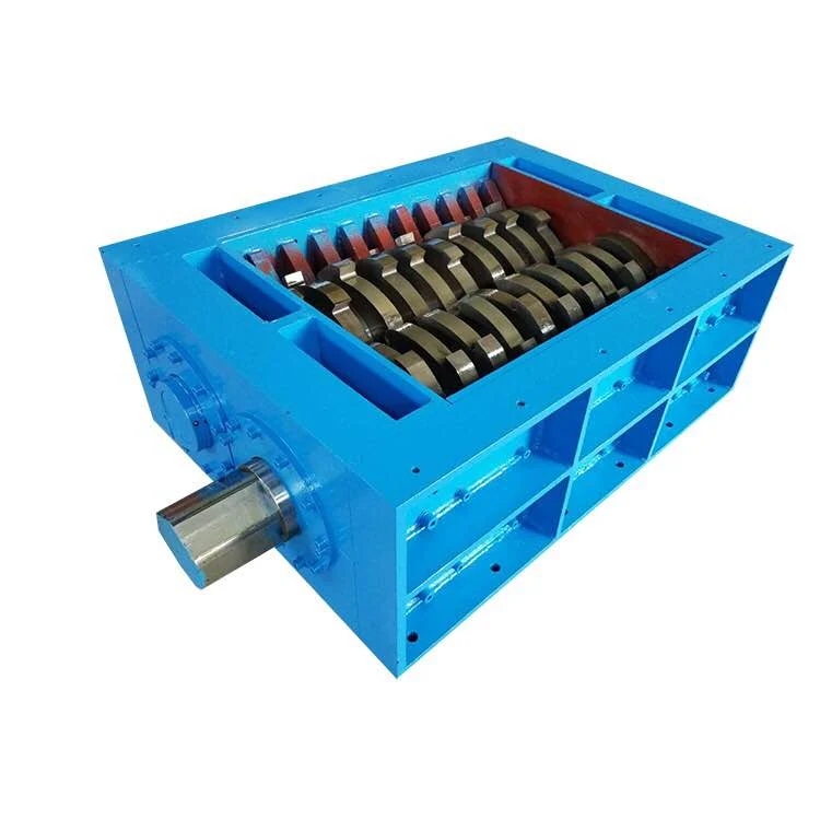 Open shredder cutting chamber with interleaved cutters.